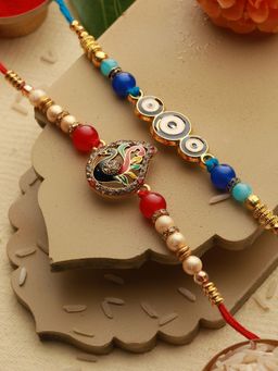 Saraf RS Jewellery - Set of 2 Evil Eye nd Peacock Rakhi with Roli Chawal