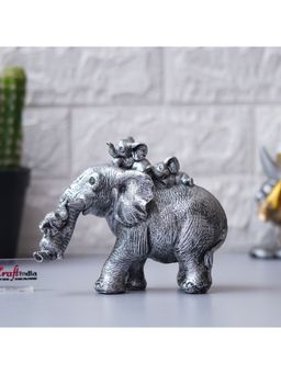 eCraftIndia - Cute Silver Elephant Statue Carries Three Calves on Its Back and Trunk