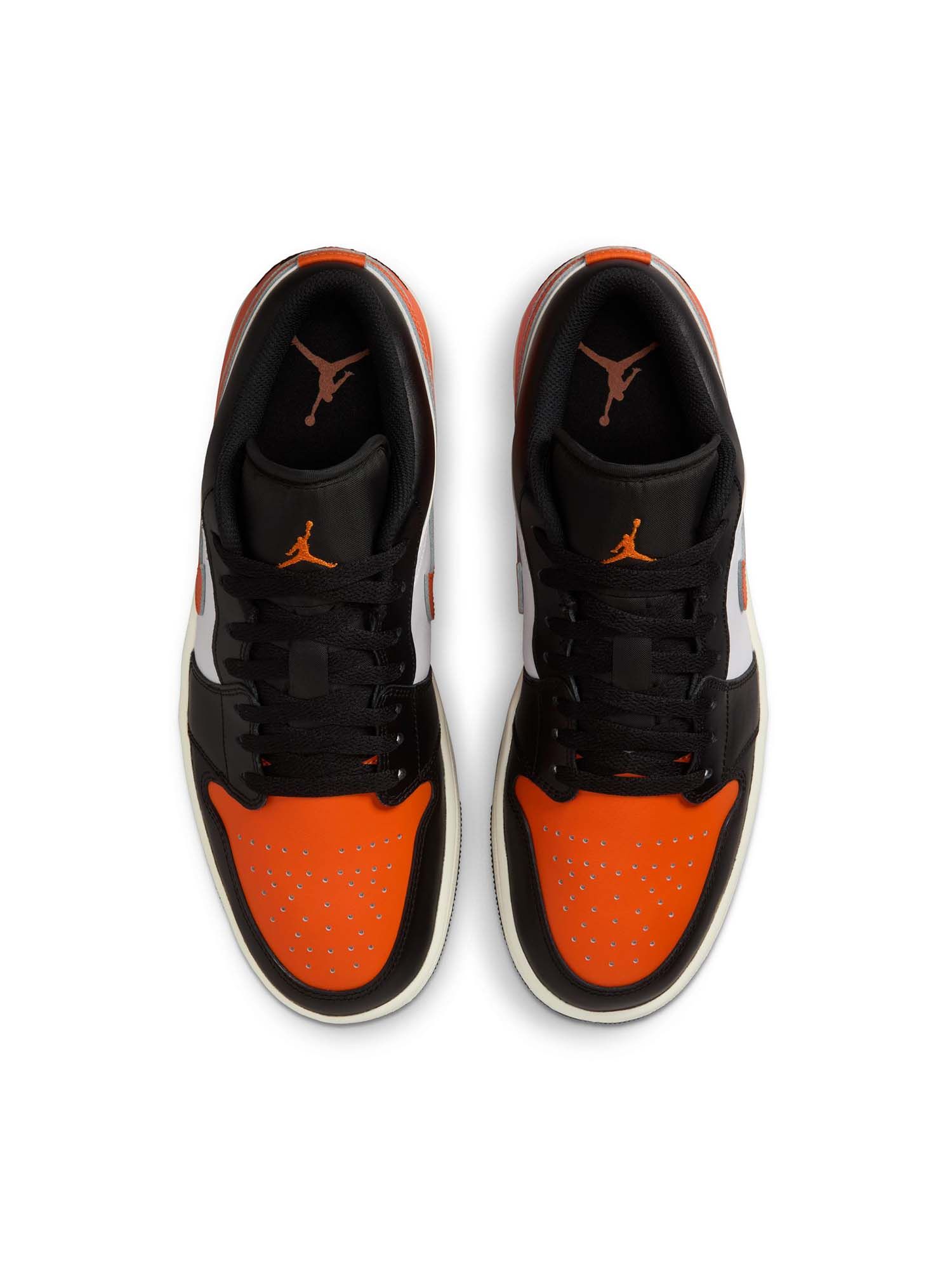 orange black and white low top ones