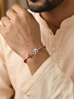 Ornate Jewels - 925 Silver Rhodium Plated OM Rudraksha Thread Rakhi With Roli Chawal