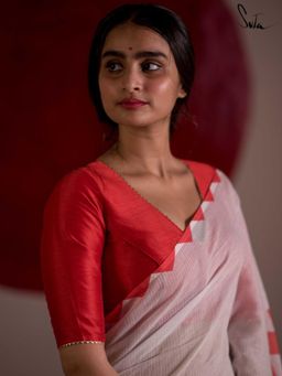 Suta - Women Red
                  Solid V-Neck Stitched Blouse - 1