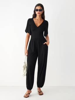 Cider - Women's V-Neck Ruched Bell Sleeve Jogger Jumpsuit Black
