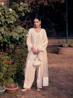 "Two Sisters" by Gyans - Ivory Short Kurta, Salwar with Dupatta and Potli
