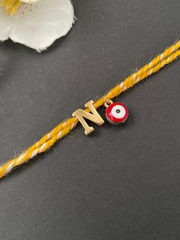 Digital Dress Room - Letter "N" Initial & Red Evil Eye Rakhi