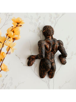 eCraftIndia - Man Pushing Wall Antique Finish Handcrafted Polyresin Wall Decorative