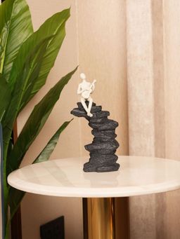 HOME 360 - White Abstract Guitarist Figurine On Stacked Rock Sculpture