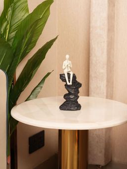 HOME 360 - White Abstract Horn Player Figurine On Stacked Rock Sculpture