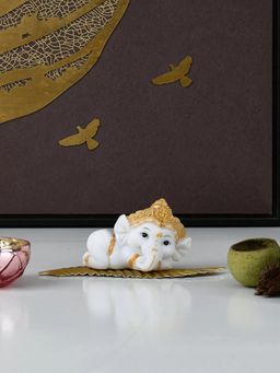 At Home by Nilkamal - Ganesha On Leaf Polyresin Showpiece (White & Gold)