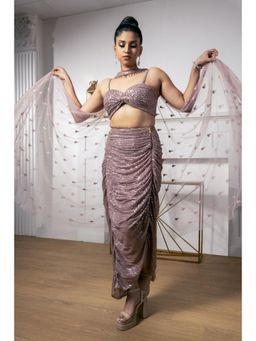 Meenagurnam - Rose Gold Net Hand Embroidered Crystal Work Draped Skirt and Blouse and Dupatta