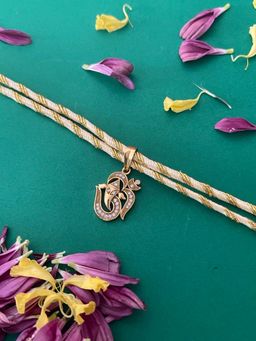 Digital Dress Room - Beautiful Thread Rakhi American Diamond Gold Plated Lord Ganesha Om Rakhi