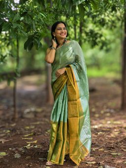 APAAPI THREADS OF GLORY - Green and Gold-Toned Tissue Mul Saree with Unstitched Blouse Piece