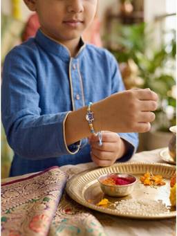 SAMIKA - Unisex Blue Traditional Rakhi Silver Rakhi and Roli with Chawal