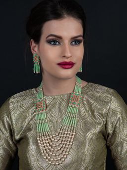 Odette - Flaunting green beads and pearl necklace