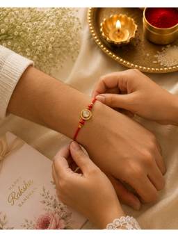 REENISAA - Radiant Crystal Halo Rakhi with Ruby Beads and Red Thread