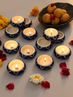 VarEesha - Orange Ivory Ceramic Diyas / Teal Light Holders Set Of 12