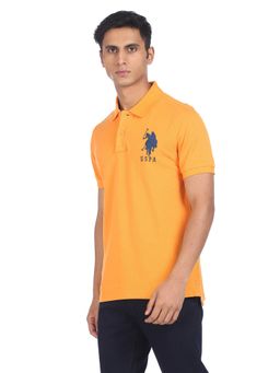 U.S. POLO ASSN. - Men Orange Cotton Solid Polo T-shirt
