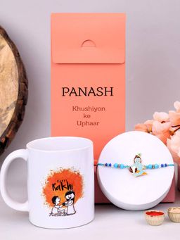 PANASH - Plated Krishna Shaped Thread Rakhi with Mug & Roli Chawal