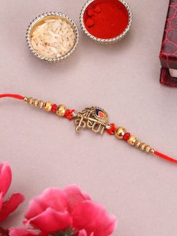 PANASH - Plated Name Of Krishna Shaped Stone Studded Rakhi with Roli Chawal