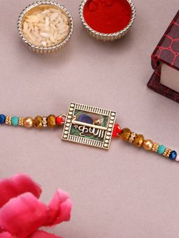 PANASH - Plated Name Of Krishna Shaped Stone Studded Rakhi with Roli Chawal