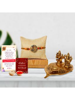 eCraftIndia - Designer Peacock Rakhi with Golden Lakshmi Ganesha Idols On Leaf Decorative Diya