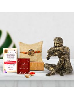 eCraftIndia - Designer Peacock Rakhi with Man Sitting In Thinking Position Statue, Roli Chawal Pack