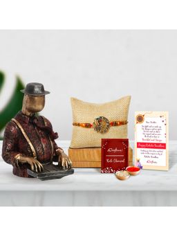 eCraftIndia - Designer Peacock Rakhi with Man Playing Piano Statue, Roli Chawal Pack