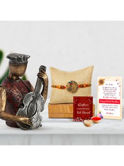 eCraftIndia - Designer Peacock Rakhi, Man Playing Guitar Statue, Roli Chawal Pack
