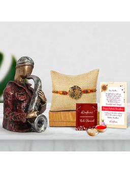 eCraftIndia - Peacock Rakhi with Man Playing Trumpet Statue, Roli Chawal Pack