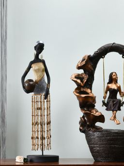 At Home by Nilkamal - Flower Tribal Lady Holding Pot Showpiece Black & Gold