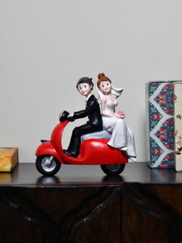 At Home by Nilkamal - Couple On Scooter Showpiece Multi Color