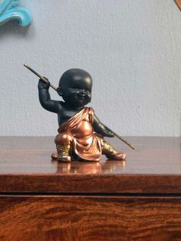 At Home by Nilkamal - Baby Monk Holding Stick Showpiece Gold