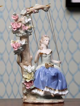 At Home by Nilkamal - Lady On Swing Showpiece Multi Color