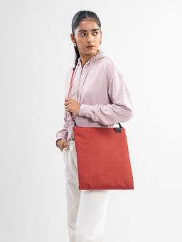 DailyObjects - Unisex Solid Orange Pivot Expandable Sling Bag
