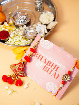 Fida - Handmade Red With Pom Pom And Kundan Studded Bhaiya Bhabhi Rakhi With Roli Chawal