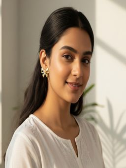 JEWELZ - Gold Tone Pearl Bow Stud Earrings