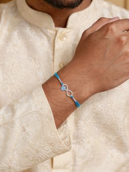 Ornate Jewels - 925 Silver American Diamond Evil Eye Infinity Thread Rakhi With Roli Chawal