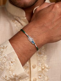 Ornate Jewels - 925 Silver Rhodium Plated Peacock Motif Thread Rakhi With Roli Chawal