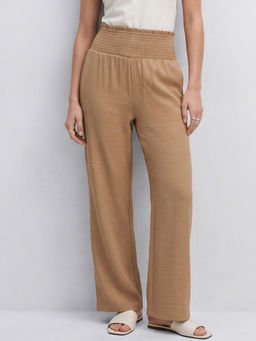 Outzidr - Women Beige Solid Straight Trouser