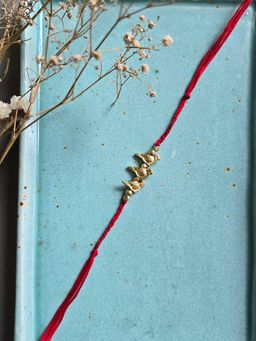 Studio Anviksha - Red Brass Bird Rakhi