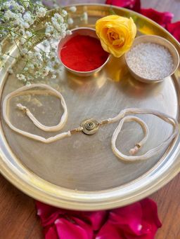 Studio Anviksha - White Spiral Brass Rakhi