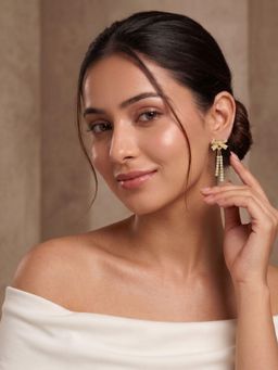 Niscka - Gold Plated Bow Design White Stone Dangler Earrings