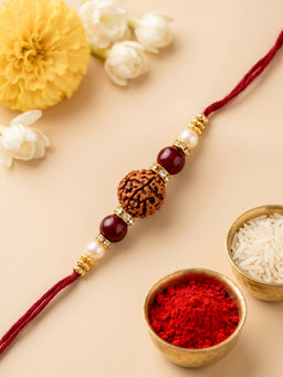 Karatcart - Multi-Color Gold Plated Rudraksha Studded Kundan Rakhi with Roli & Chawal