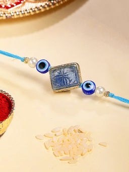 Karatcart - Gold Plated Blue Carved Stone Evil Eye Kundan Rakhi with Roli & Chawal
