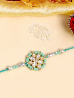 Karatcart - Gold Plated Light Blue Crystal Floral Kundan Bhaiya Rakhi with Roli Chawal