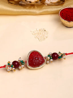 Karatcart - Gold Plated Red Carved Stone Kundan Bhaiya Rakhi with Roli & Chawal