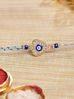 Karatcart - Gold Plated Blue American Diamond Heart Shape Evil Eye Kundan Rakhi with Roli & Chawal