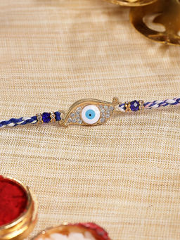 Karatcart - Gold Plated Blue American Diamond Eye Shape Evil Eye Kundan Rakhi with Roli & Chawal