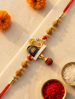 Karatcart - Multi-Color Gold Plated Rudraksha Studded Shivling Kundan Rakhi with Roli & Chawal