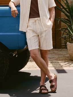 The Indian Garage Co - Men Cream Relaxed Fit Vertical Striped Cross Pocket Mid-Rise Shorts