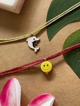 Digital Dress Room - Gold Plated Dolphin and Yellow Smiley Charm Rakhis (Pack of 2)